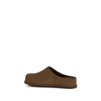 UGG brown calf leather Bos Taurus mules with slip-on design and low heel, stylish and comfortable women's footwear.