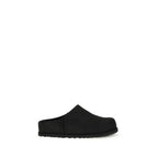 Black calf leather UGG Bos Taurus mules with slip-on design and pointed toe, showcasing stylish and comfortable women's footwear.