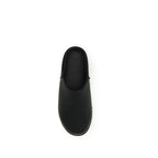 UGG black calf leather Bos Taurus mules with pointed toes and slip-on design, showcasing elegant and comfortable footwear.