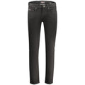 Black cotton men's jeans by Guess Jeans, showing a close-up of the fitted denim fabric and classic five-pocket design.