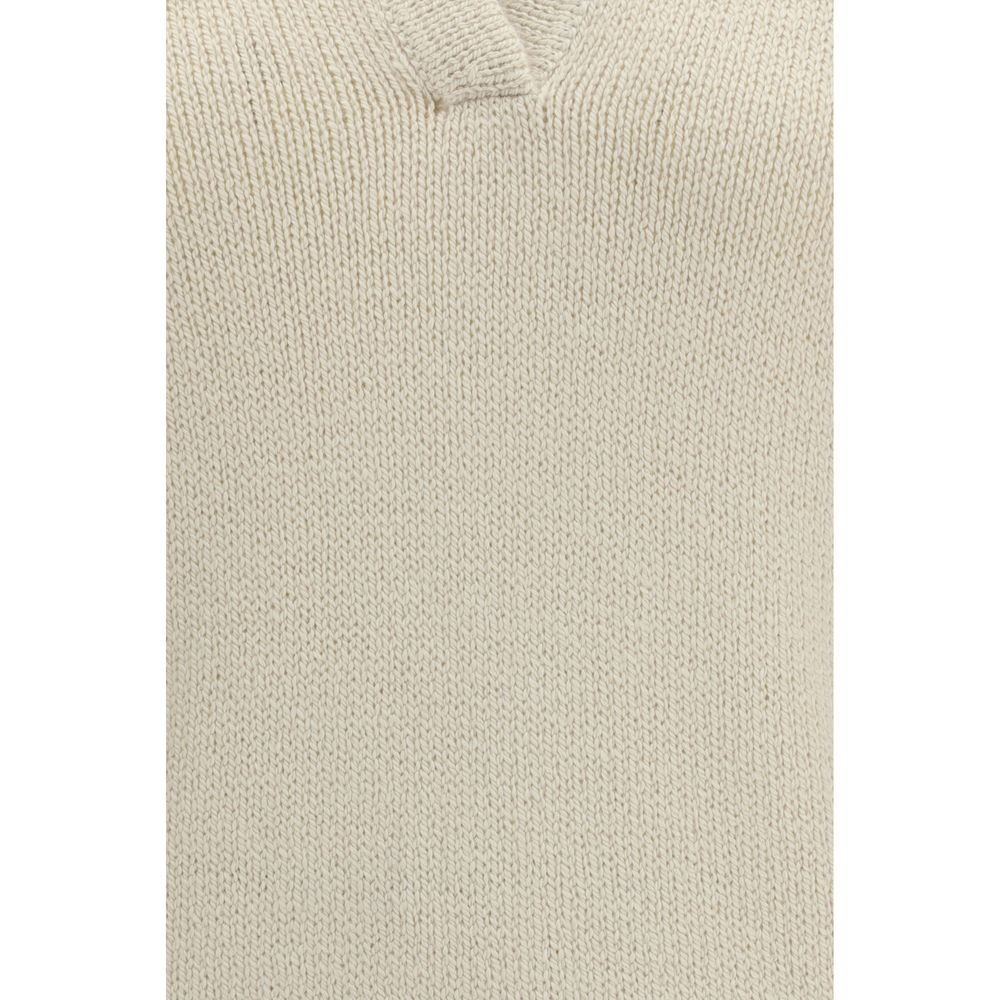 Beige cashmere polo shirt by Gabriela Hearst displayed on a hanger, showcasing soft texture and classic fit.