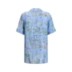 Gucci blue silk patterned shirt with long sleeves and button-up front, featuring a stylish and luxurious design.