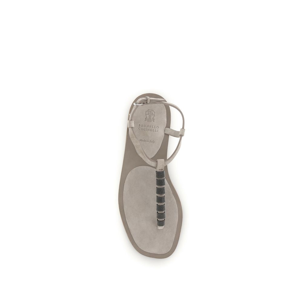 Beige calf leather Bos Taurus flat sandals by Brunello Cucinelli with minimalist design and subtle stitching details.