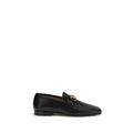 Valentino Garavani black goatskin slip-on loafers with sleek design and subtle stitching on a plain background.