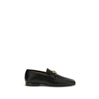 Valentino Garavani black goatskin slip-on loafers with sleek design and subtle stitching on a plain background.