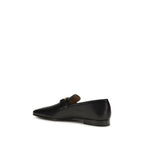 Valentino Garavani black goatskin slip-on loafers with sleek design and classic style, perfect for casual or formal wear.