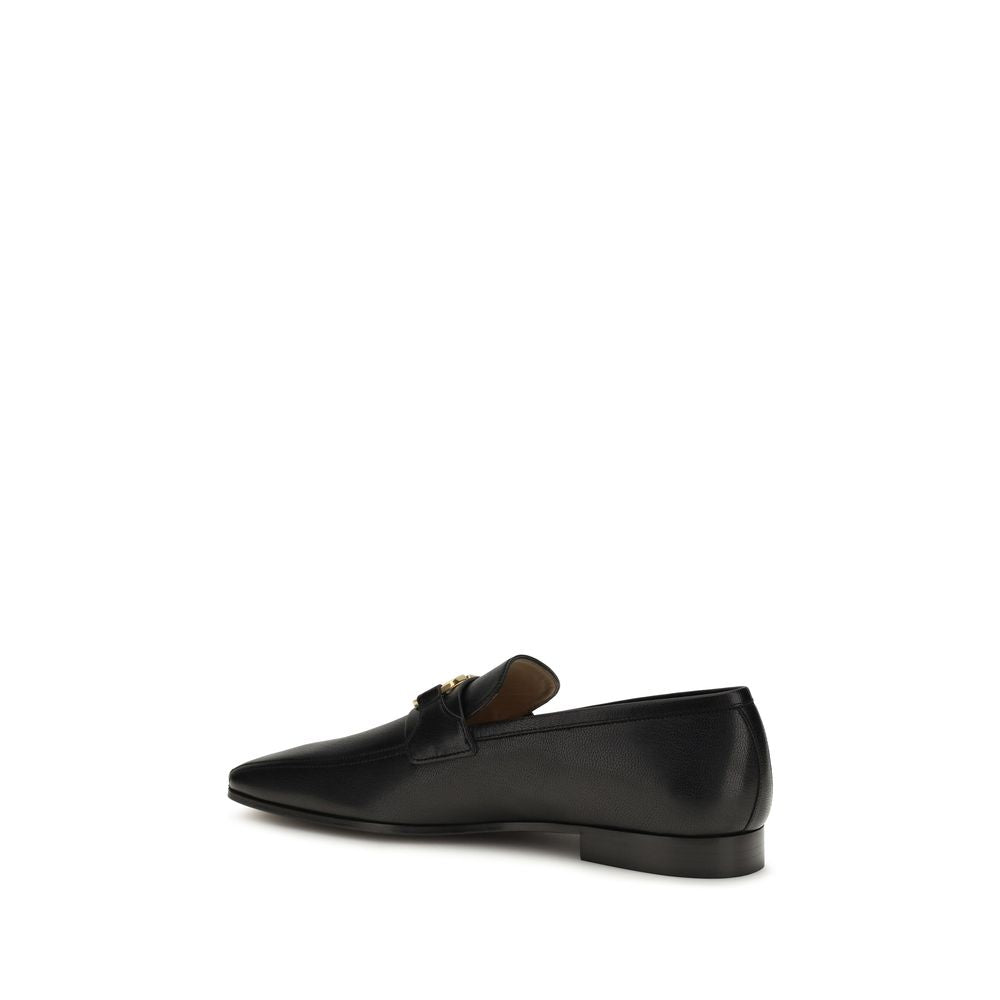 Valentino Garavani black goatskin slip-on loafers with sleek design and classic style, perfect for casual or formal wear.