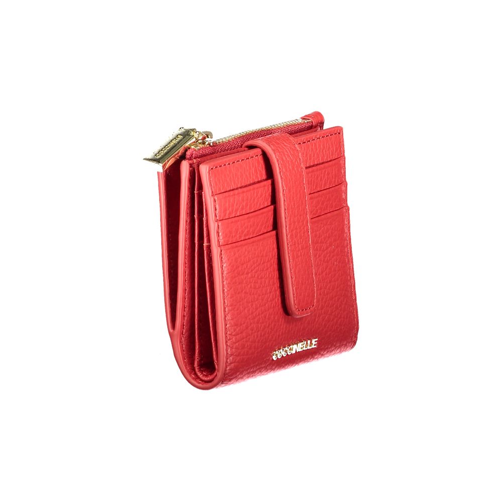 Red leather women's wallet by Coccinelle featuring a sleek, compact design with subtle branding and multiple card slots.