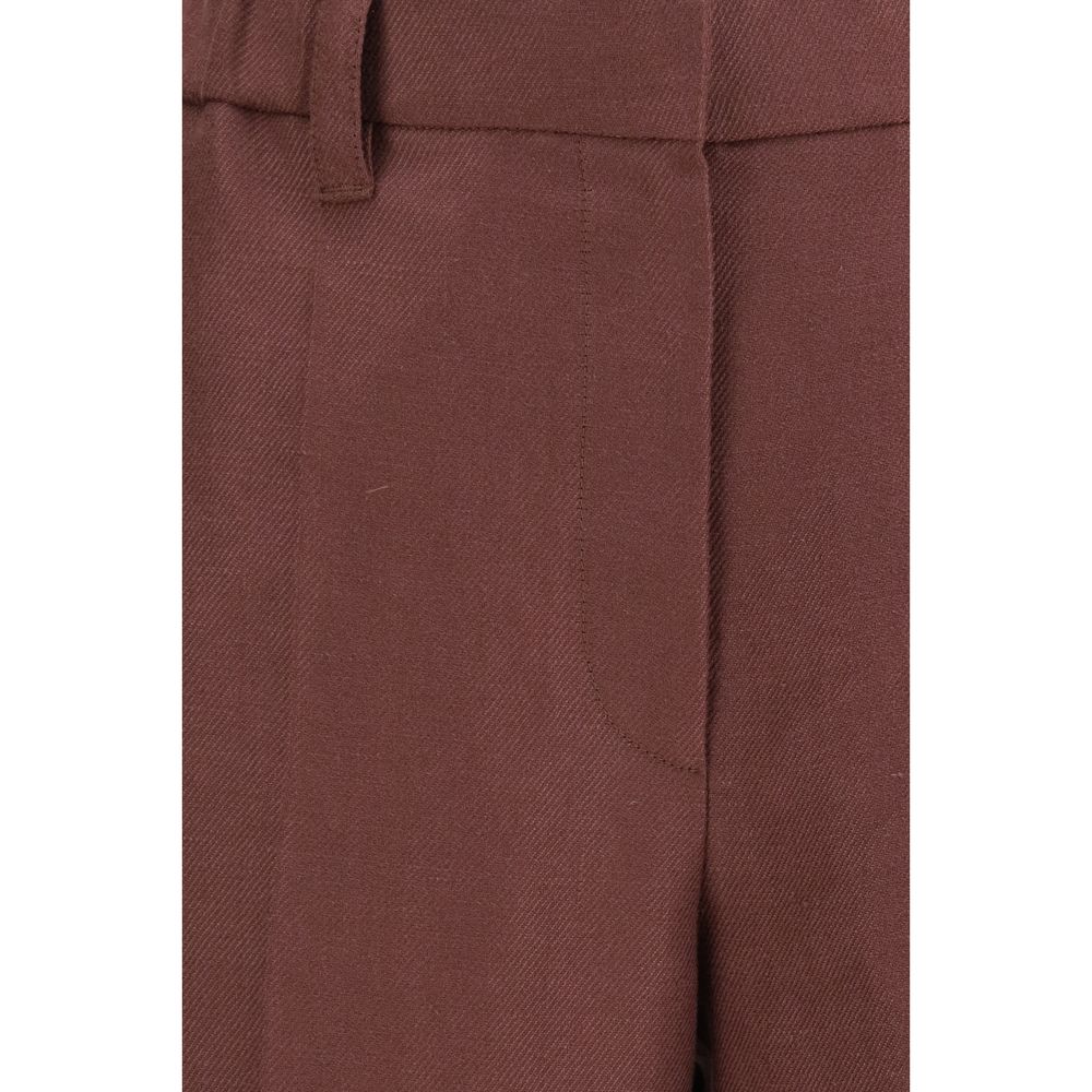 Brunello Cucinelli brown linen casual pants displayed on a hanger, showcasing relaxed fit and lightweight fabric.
