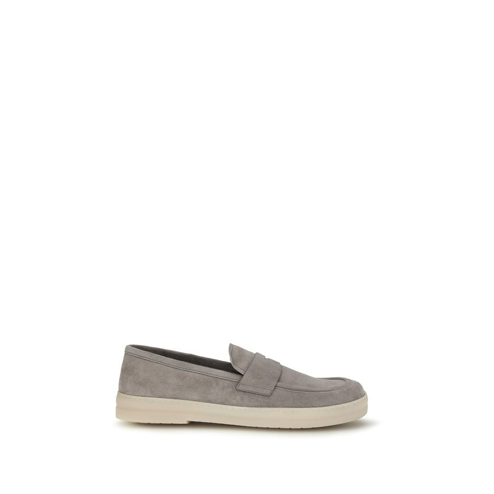 Prada gray calf leather Bos Taurus slip-on loafers with sleek design and smooth finish, perfect for stylish casual wear.