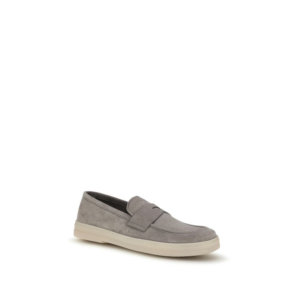 Prada Gray Calf Leather Bos Taurus Slip-On Loafers with sleek design and loafers style, showcasing smooth leather finish.