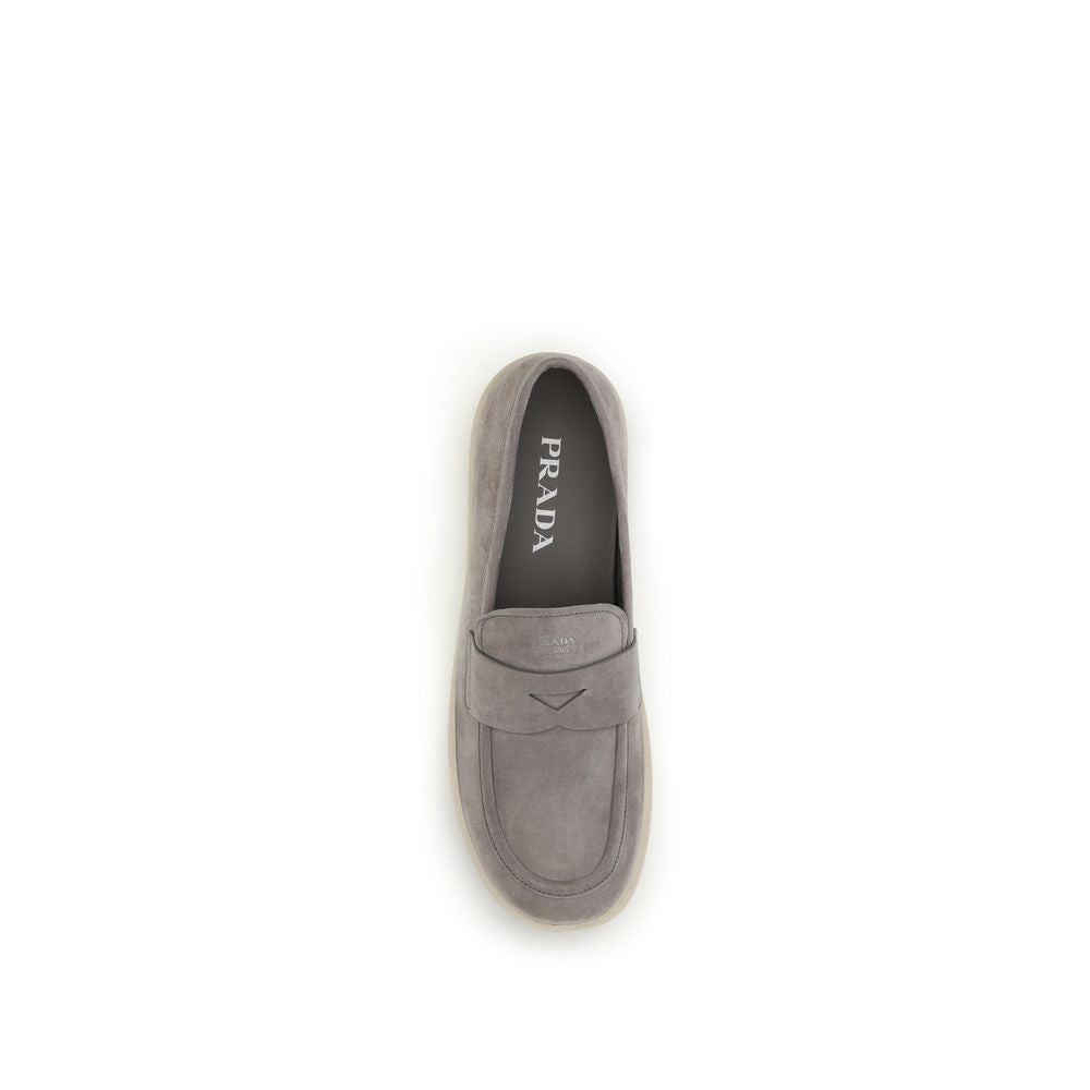 Prada gray calf leather Bos Taurus slip-on loafers with sleek design and minimal detailing.