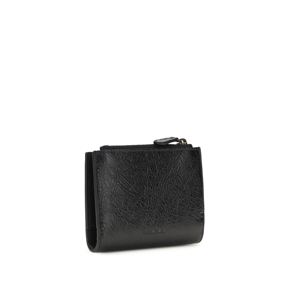 Black Balenciaga Lamb Ovis Aries wallet with sleek design and branding, featuring multiple card slots and a zip compartment.