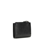 Black Balenciaga Lamb Ovis Aries wallet with sleek design and branding, featuring multiple card slots and a zip compartment.