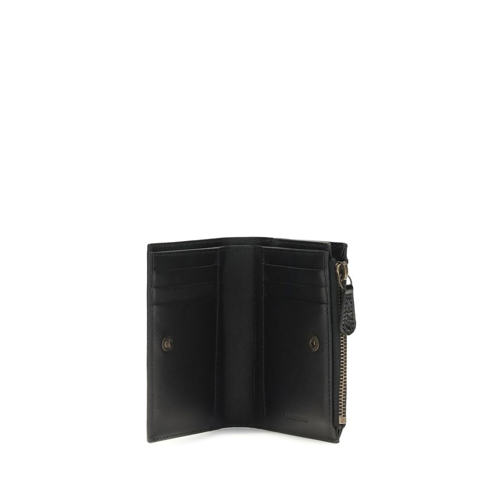 Black Balenciaga lamb leather Ovis Aries wallet with sleek design and subtle branding, featuring multiple card slots and a compact silhouette.