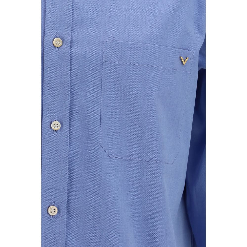 Valentino Garavani blue cotton shirt displayed flat with collar and button details, showcasing a stylish men's casual wear piece.