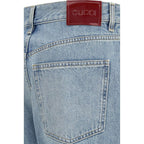 Gucci blue cotton straight-leg jeans, casual fit with classic five-pocket design and belt loops, on a plain background.