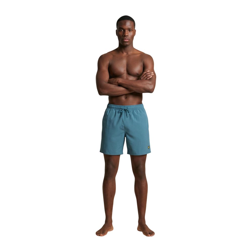 Lyle & Scott blue polyamide swim shorts with elastic waistband and side pockets, suitable for beach or pool activities.