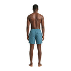 Lyle & Scott blue polyamide swim shorts with elastic waistband and side pockets, designed for beach and pool activities.