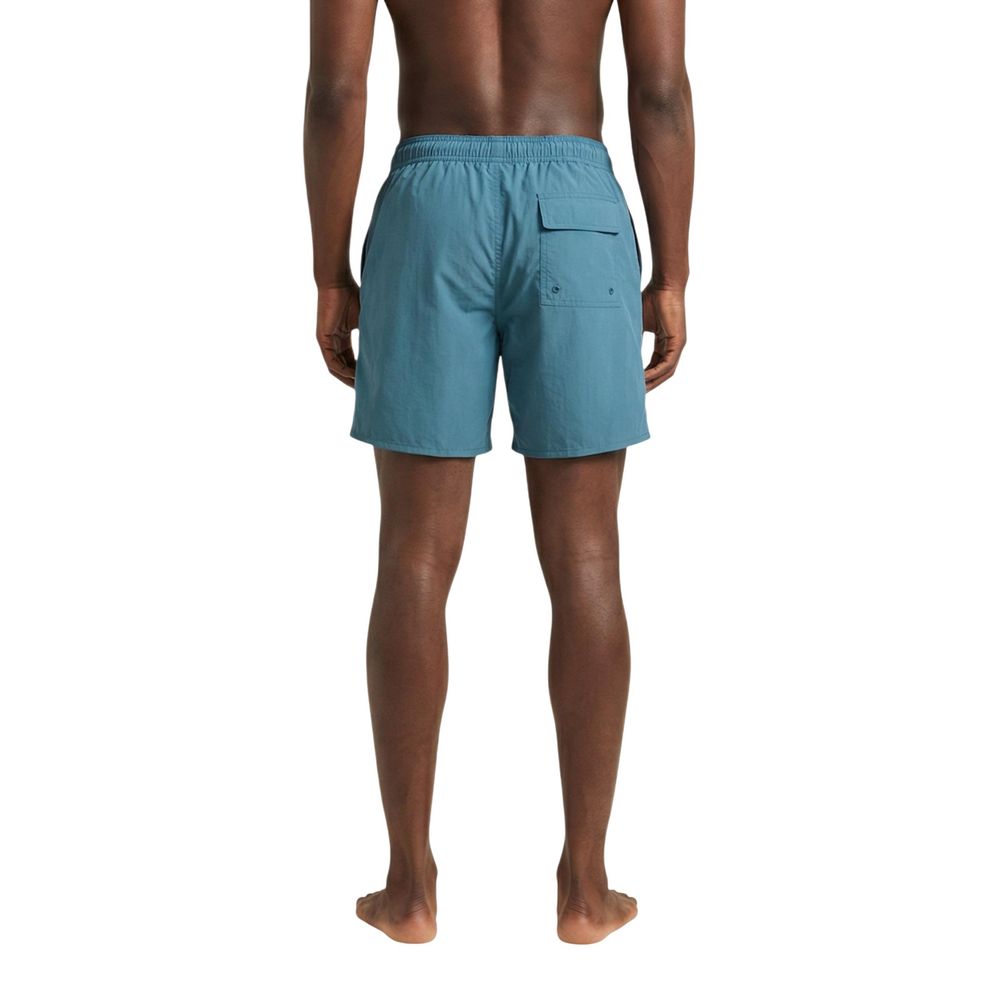 Lyle & Scott blue polyamide swim shorts with elastic waistband and side pockets, designed for comfortable beach or pool use.