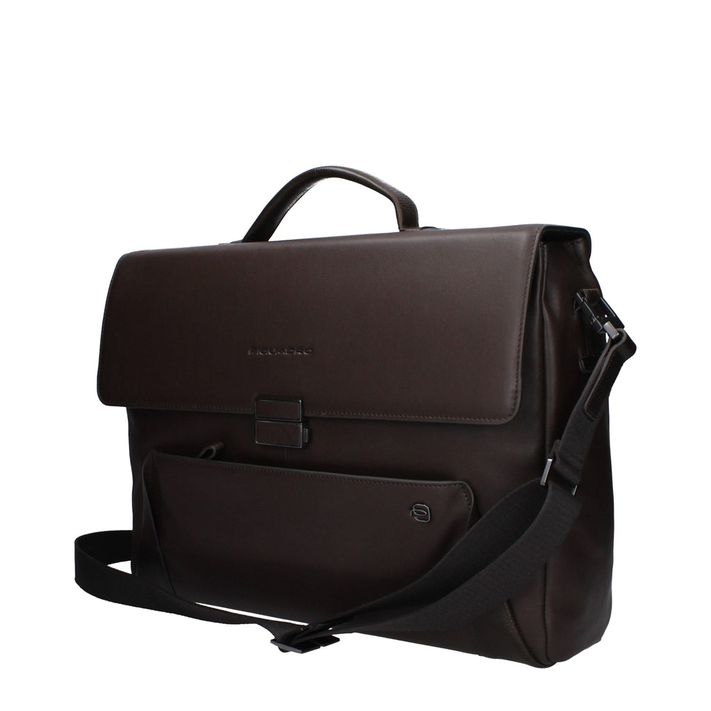 Piquadro brown leather business and laptop bag with adjustable shoulder strap and multiple compartments for organization.