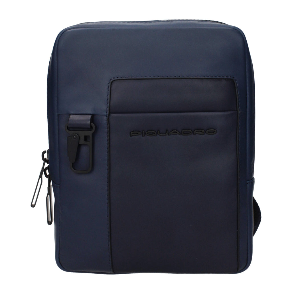 Piquadro blue leather crossbody bag with adjustable strap, featuring sleek design and compact size for everyday use.