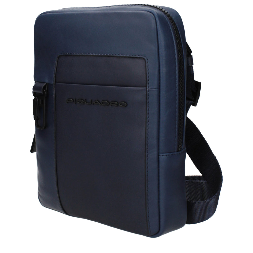 Piquadro blue leather crossbody bag with adjustable strap and sleek design, featuring a front pocket and subtle branding.