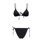 Kristina Ti black polyester bikini top with adjustable straps and supportive design, shown on a model.