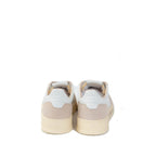 Autry white goatskin athletic sneakers with lace-up design and cushioned soles, stylish and comfortable for casual wear.