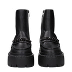 Black leather Jimmy Choo ankle boots with sleek design and pointed toes, stylish footwear for modern fashion.