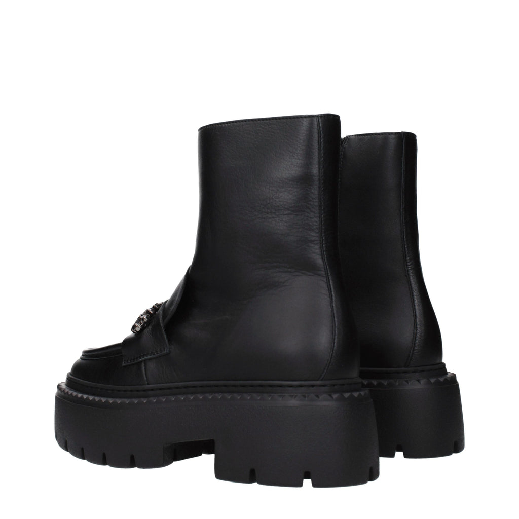 Jimmy Choo black leather ankle boots with sleek design and pointed toes, stylish footwear for women.