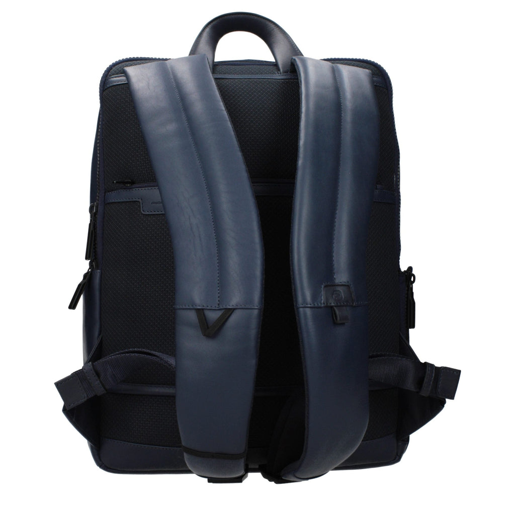 Piquadro blue leather backpack with adjustable straps and multiple compartments, showcasing sleek, durable design.