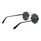 Guess black metal sunglasses with sleek frame and dark tinted lenses, stylish and modern eyewear for fashionable sun protection.
