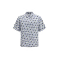 Prada multicolor cotton shirt with vibrant pattern and button-up front, displayed on a hanger.