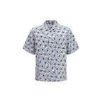 Prada multicolor cotton shirt with vibrant pattern and button-up front, displayed on a hanger.