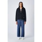 Champion black polyester full-length jacket with front zipper and side pockets, designed for casual and athletic wear.