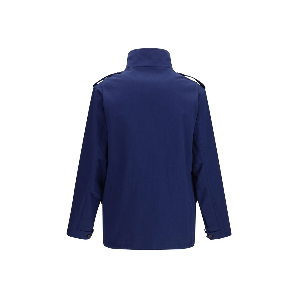 Valentino Garavani blue cotton coat displayed on a hanger, showcasing its tailored design and vibrant color.