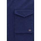 Valentino Garavani blue cotton coat displayed on a hanger, showcasing a stylish and tailored outerwear piece.