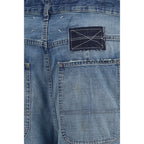Maison Margiela blue cotton relaxed fit jeans with classic five-pocket design and subtle branding, displayed on a hanger.