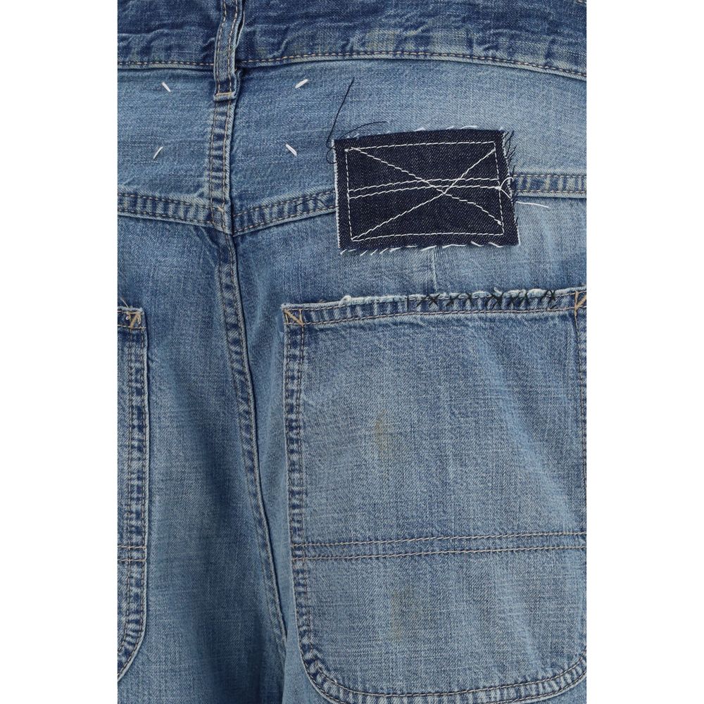Maison Margiela blue cotton relaxed fit jeans with classic five-pocket design and subtle branding, displayed on a hanger.