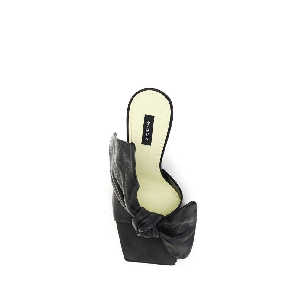 Givenchy black lamb leather high heel pumps with pointed toes and sleek design.