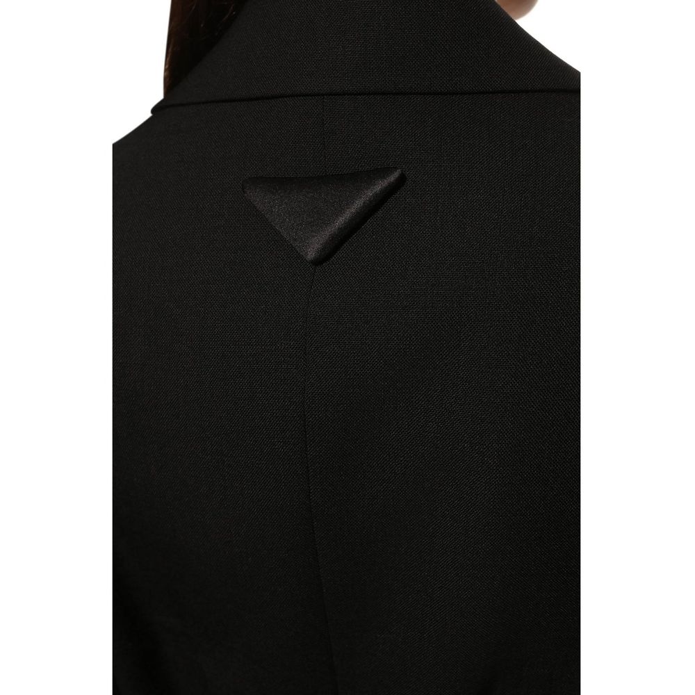 Prada black wool blazer displayed on a hanger, showcasing tailored fit and classic design for sophisticated style.