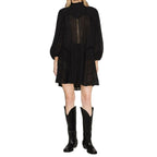 Black cotton casual dress by Isabel Marant Étoile, shown on a hanger with a simple, relaxed fit and minimal design.