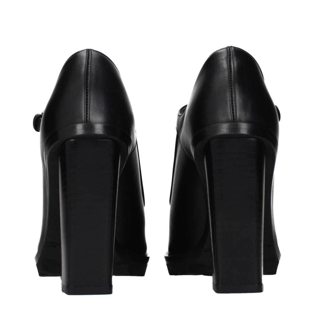 Black leather high heel pumps by Max Mara, featuring sleek design and pointed toes, ideal for elegant footwear.