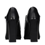 Black leather high heel pumps by Max Mara, featuring sleek design and pointed toes, ideal for elegant footwear.
