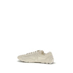 Prada beige calf leather Bos Taurus sneakers with white soles and subtle branding, stylish and comfortable casual footwear.