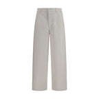 Ami Paris white cotton denim jeans, slim fit style with classic five-pocket design and button fly, shown on a model.