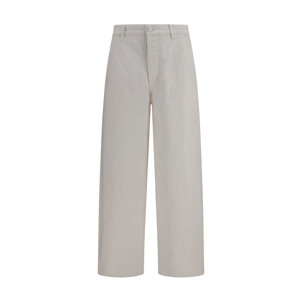 Ami Paris white cotton denim jeans, slim fit style with classic five-pocket design and button fly, shown on a model.
