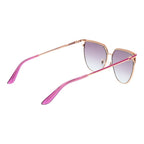 Guess rose gold metal sunglasses with round frames and tinted lenses, stylish accessory for sun protection and fashion.