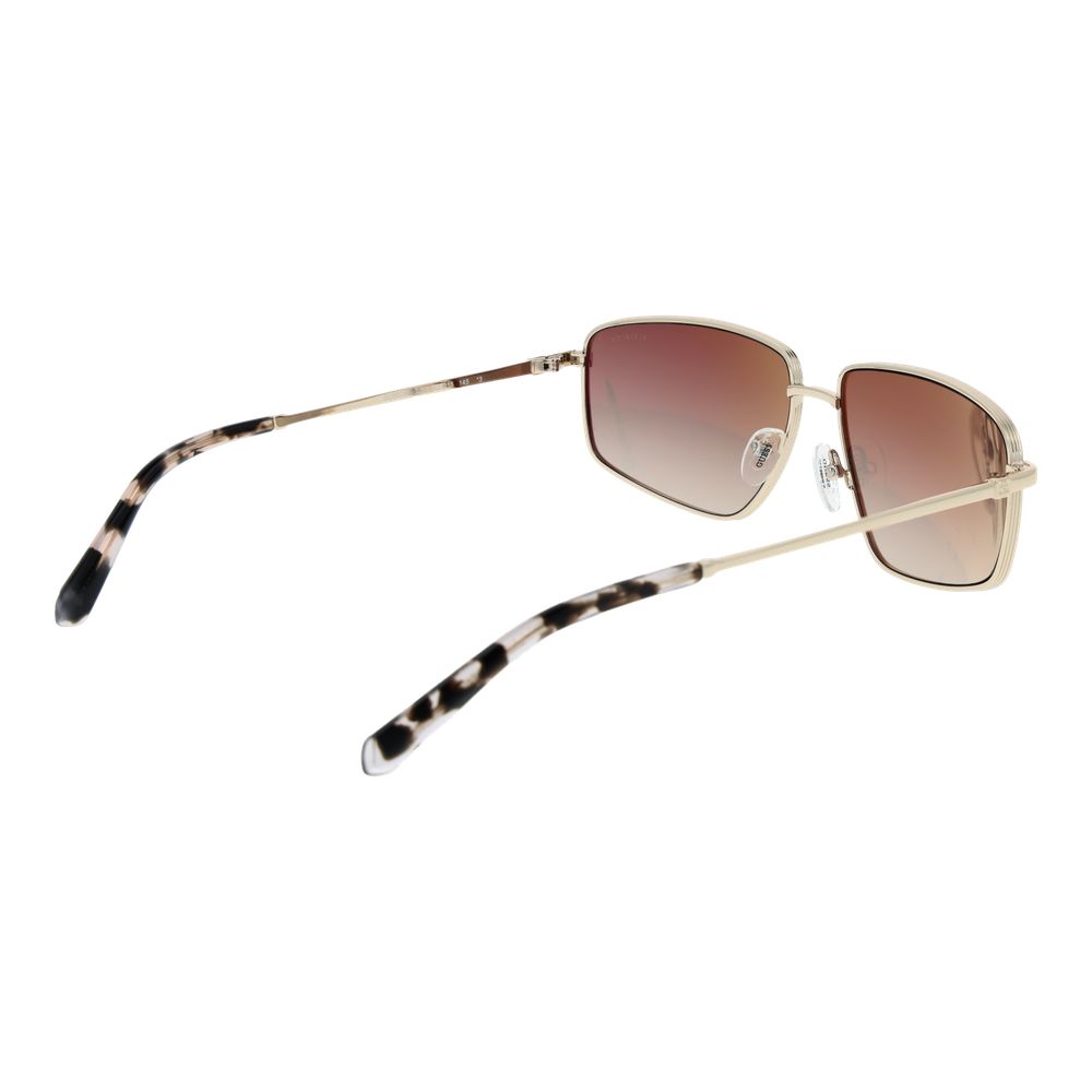 Gold metal Guess sunglasses with round lenses and slim frame, stylish eyewear for a fashionable look.